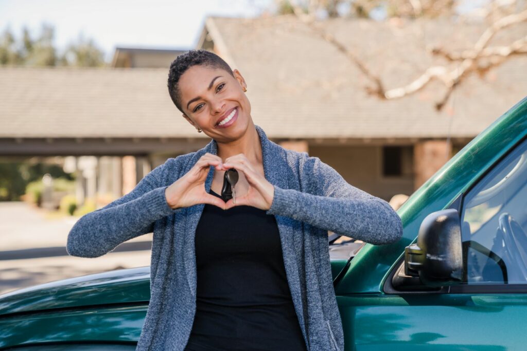 Woman in front of car